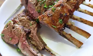 A perfectly cooked rack of lamb, seasoned and roasted to perfection. This delicious roast lamb recipe is a showstopper!