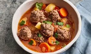 Hearty albondigas soup from Spain, with tender meatballs, potatoes, carrots, and cilantro in a rich broth.