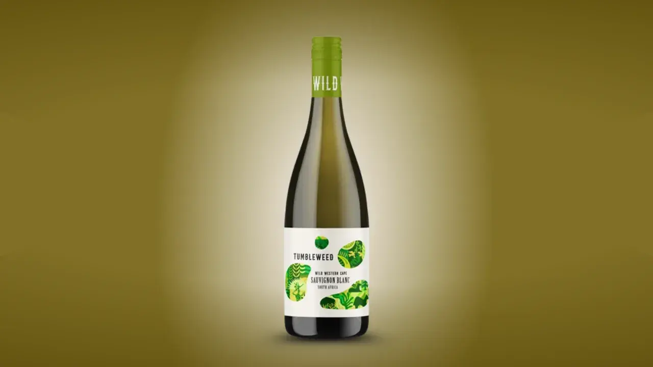 A bottle of Tumbleweed Sauvignon Blanc, a dry white wine from South Africa, with a green cap and a label featuring abstract green leaf patterns.