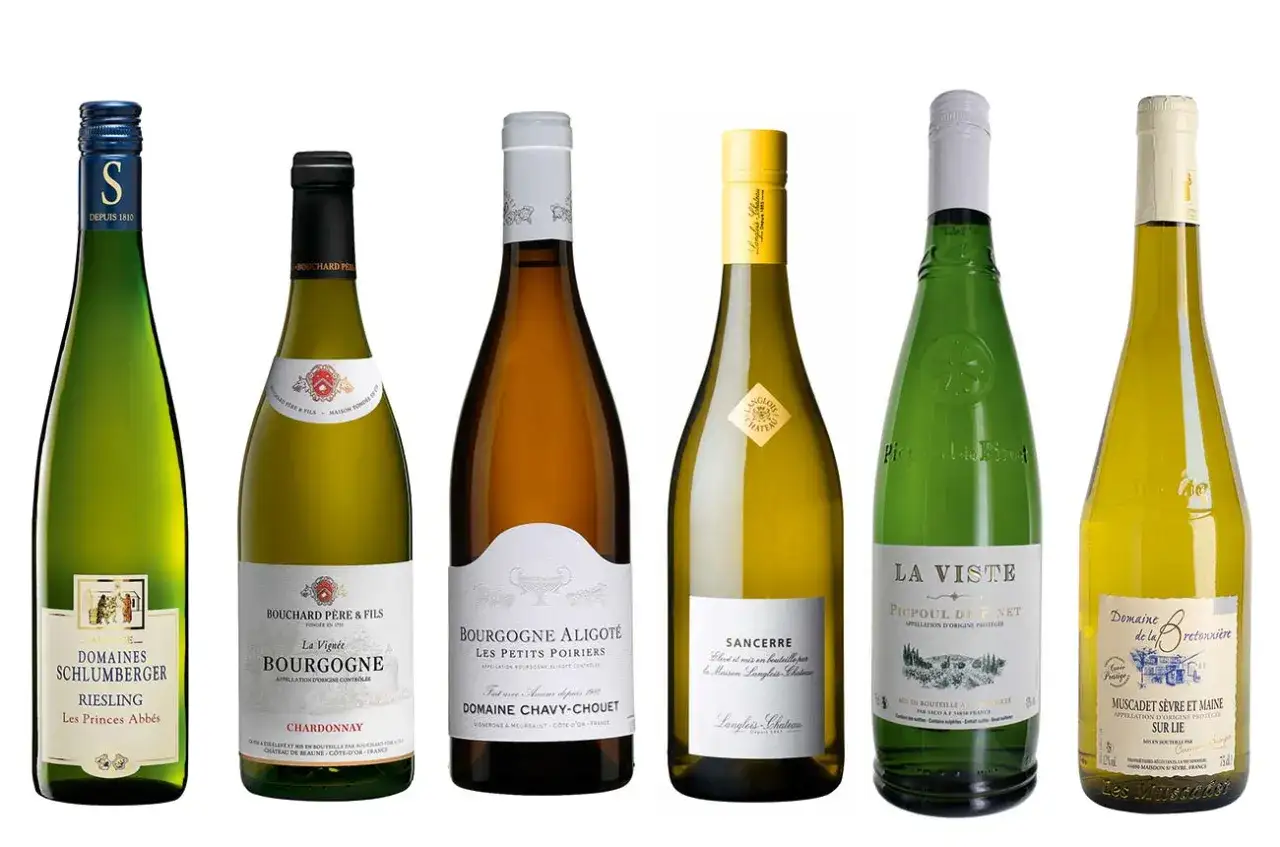 A collection of six bottles of french white wine, including Riesling, Chardonnay, Aligoté, Sancerre, and Muscadet.