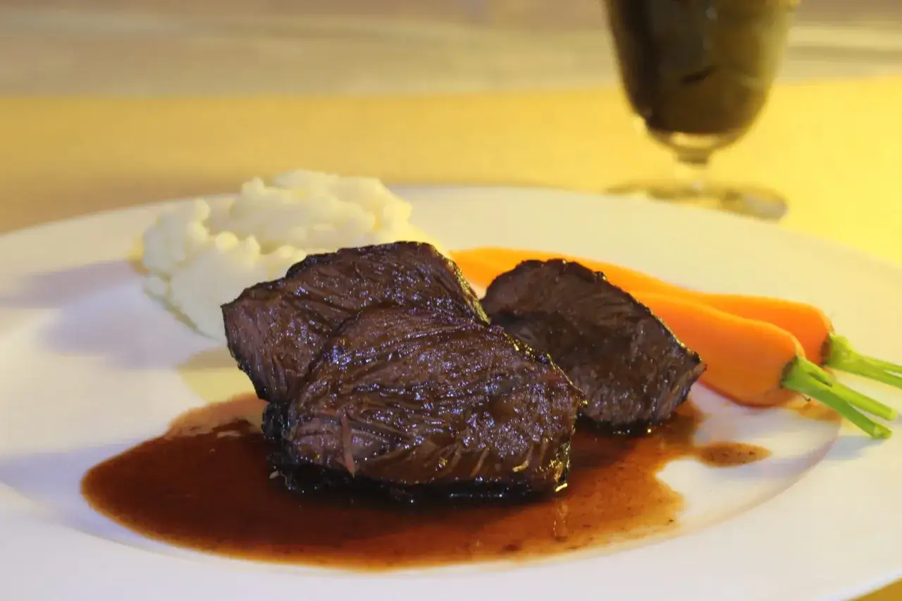 Tender beef cheek, Spanish style, served with mashed potatoes and carrots.